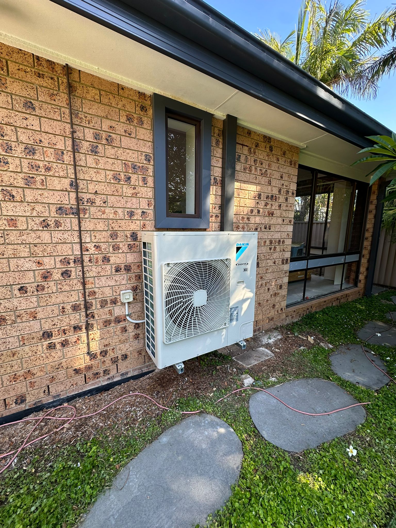 Toptech Air team at work installing an air conditioning system in a Sydney property
