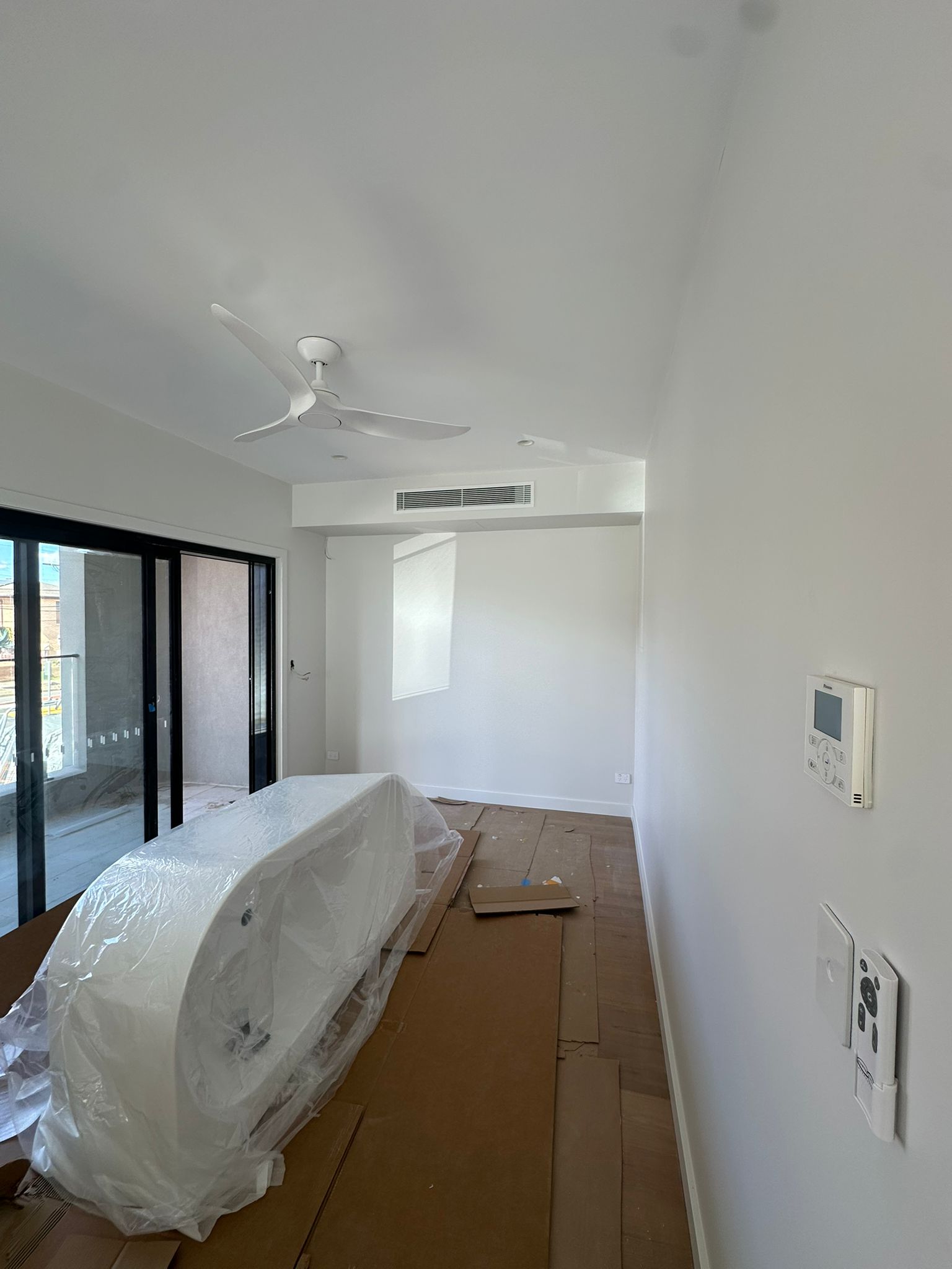 Toptech Air technician performing a professional air conditioner installation in a Sydney home