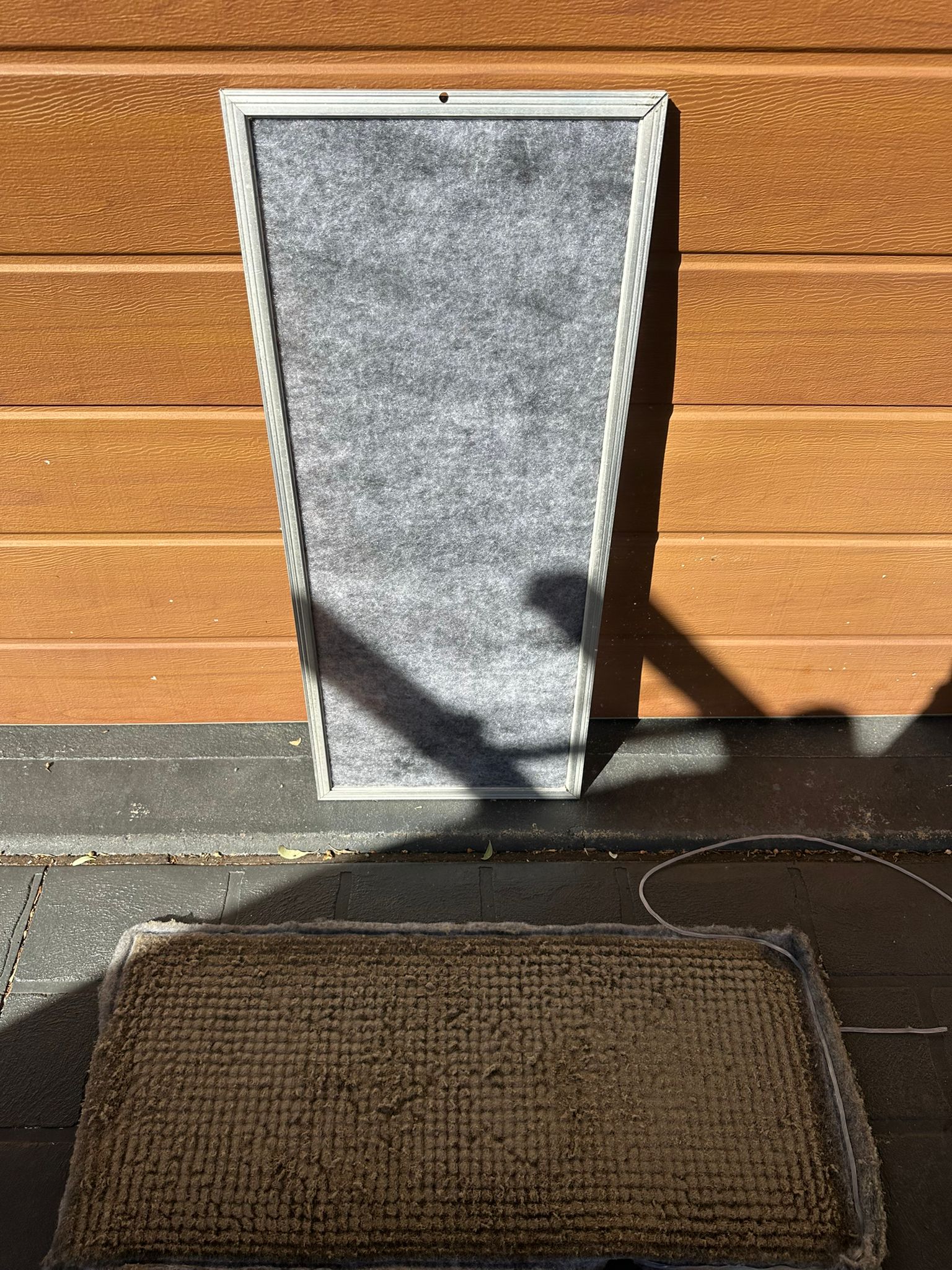 Licensed Toptech Air technician completing a professional air conditioning installation on an interior wall in a Sydney home